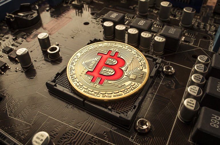 Motherboard Featuring a Bitcoin Token (In Golden Coinage)