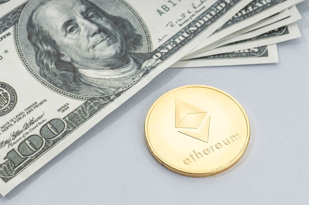 Golden Ethereum token and US dollar notes
